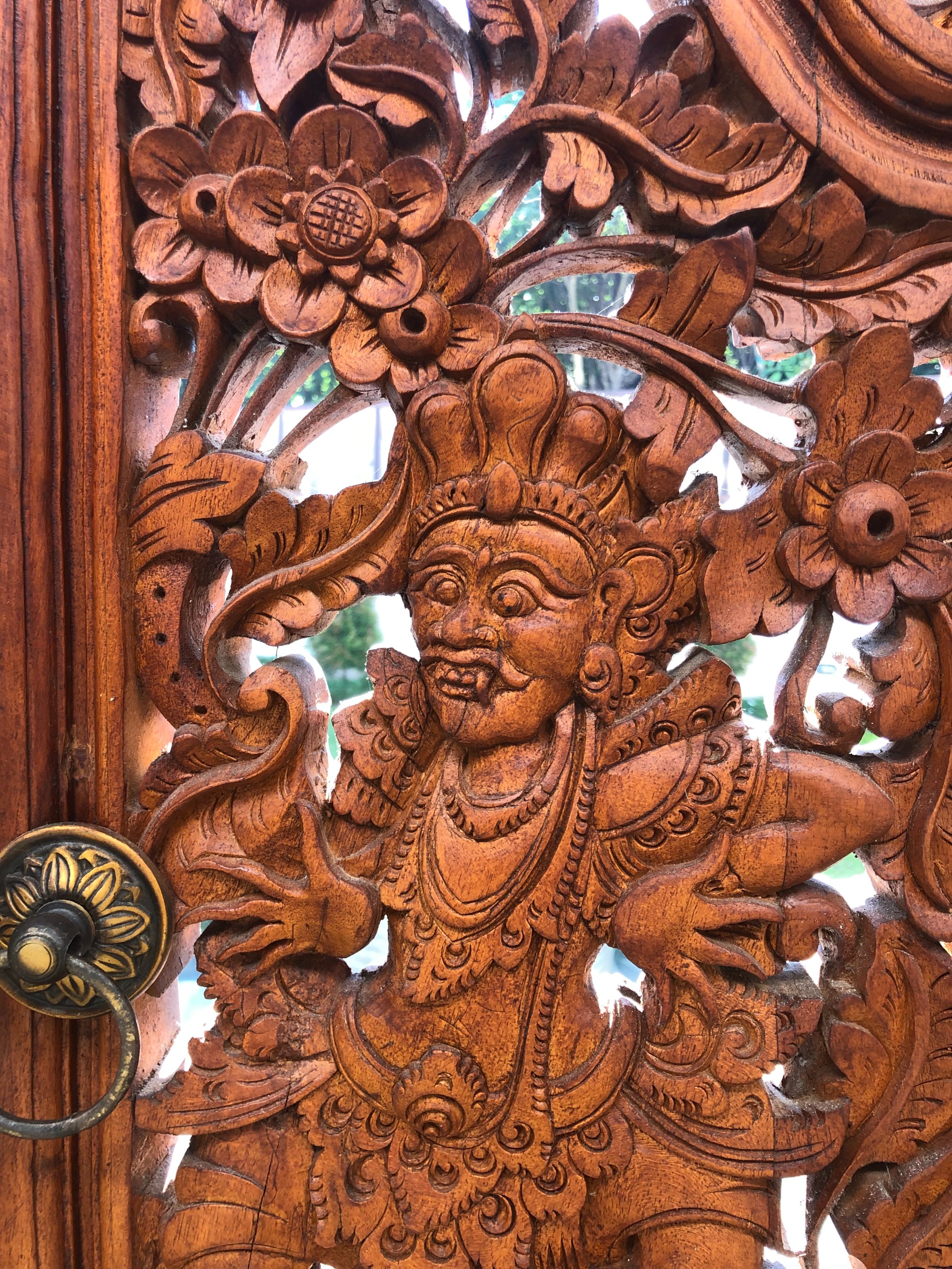 Carved deity on the entry door