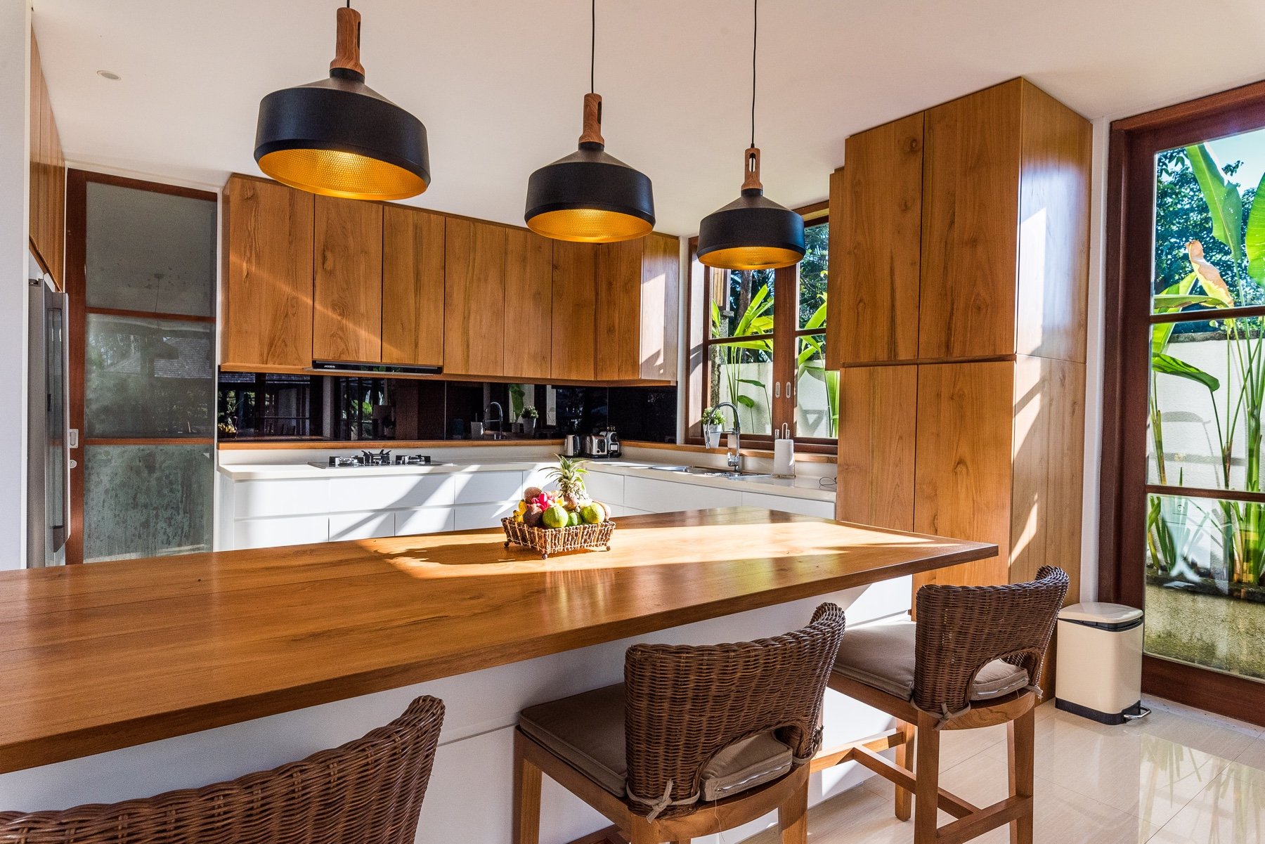 Open kitchen with rattan pendants